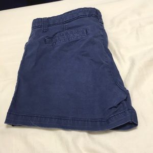 Two navy blue, one white, one blue jean